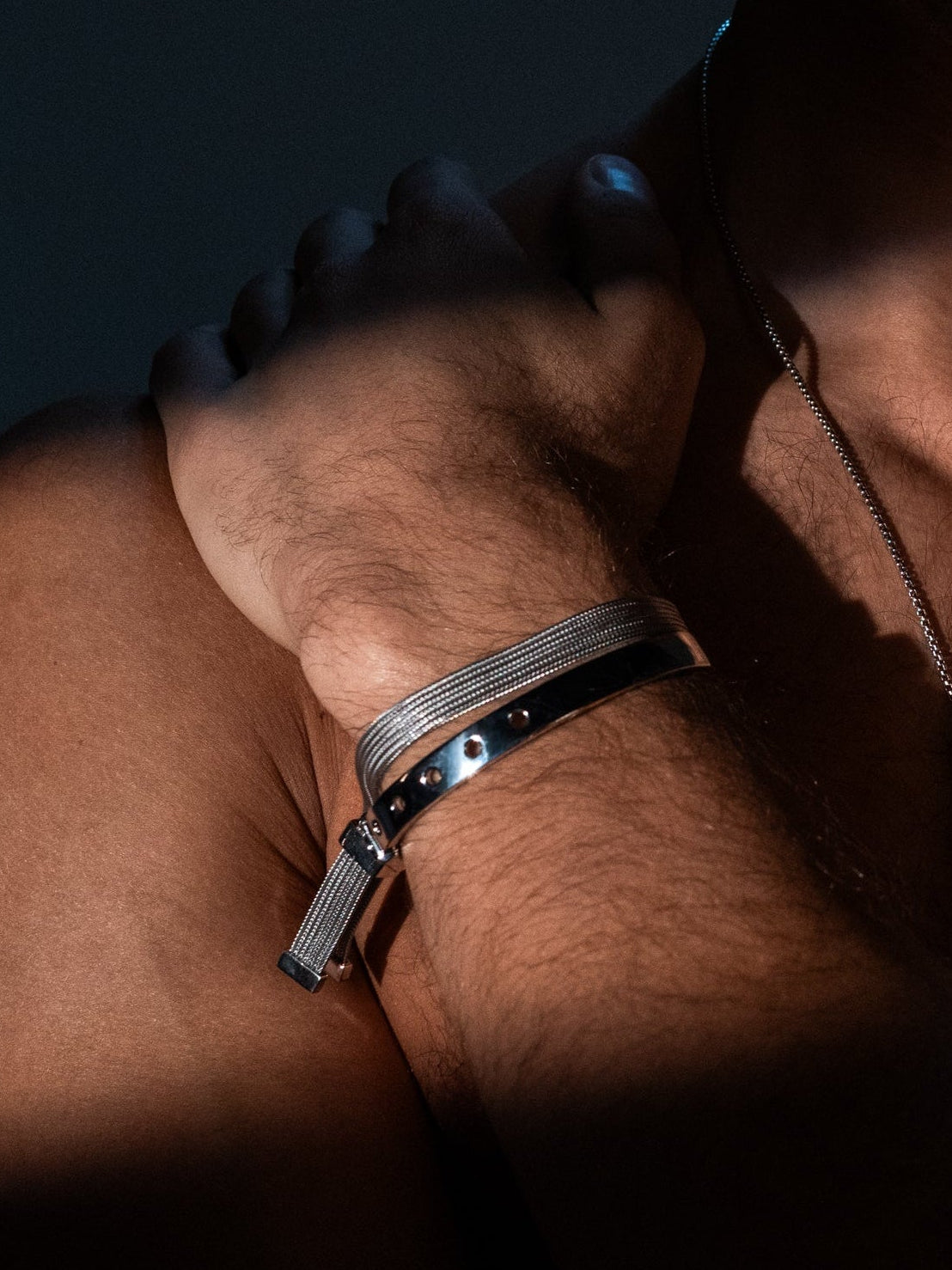 silver cuff bracelet on male model