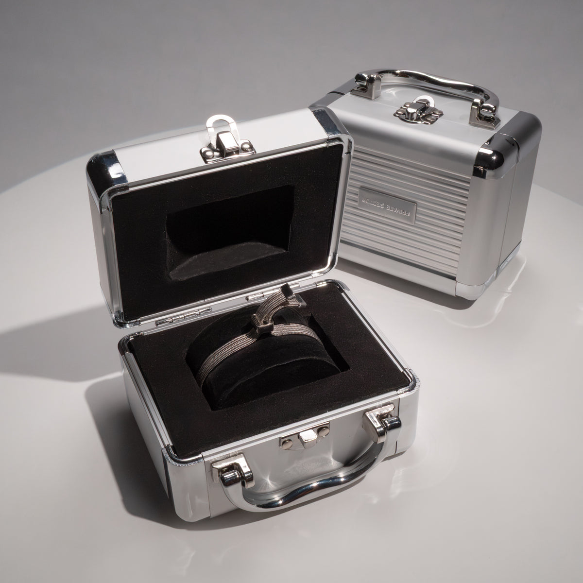 silver mesh bracelet in a metal briefcase