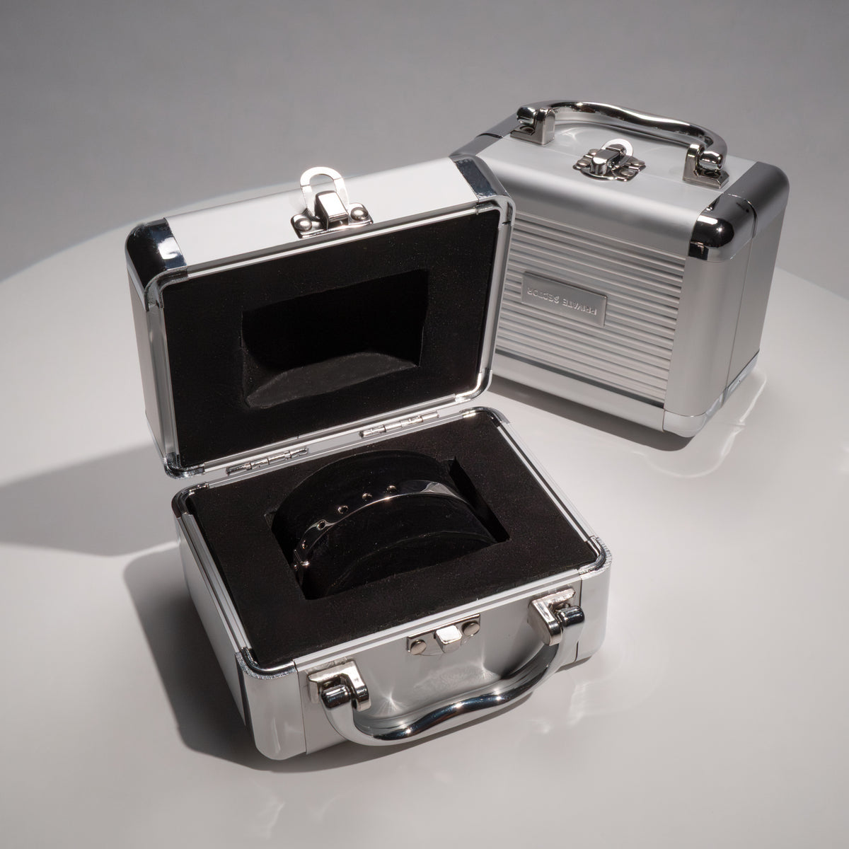 silver cuff bracelet in a metal briefcase
