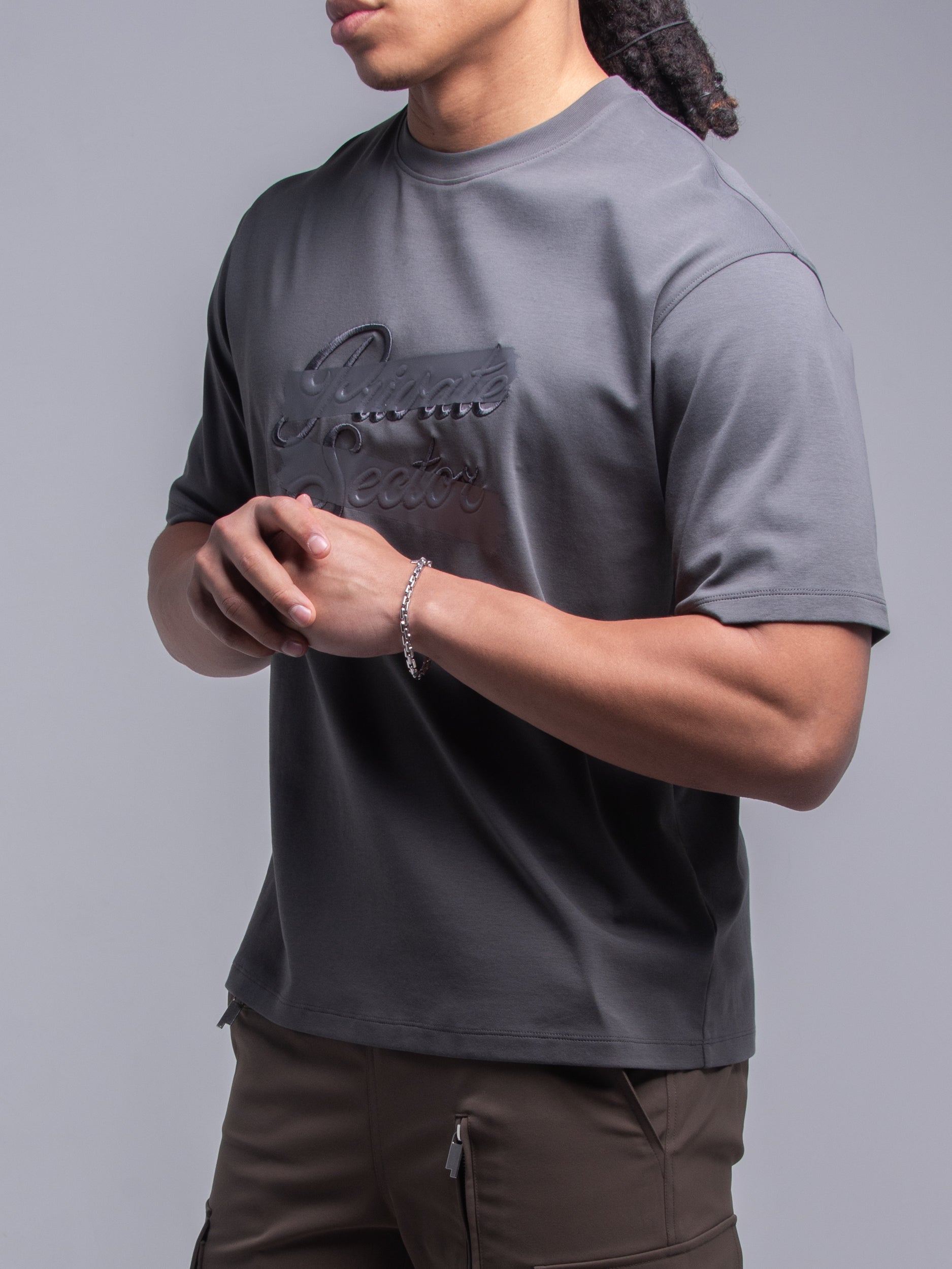 silver bracelet on a male model's wrist