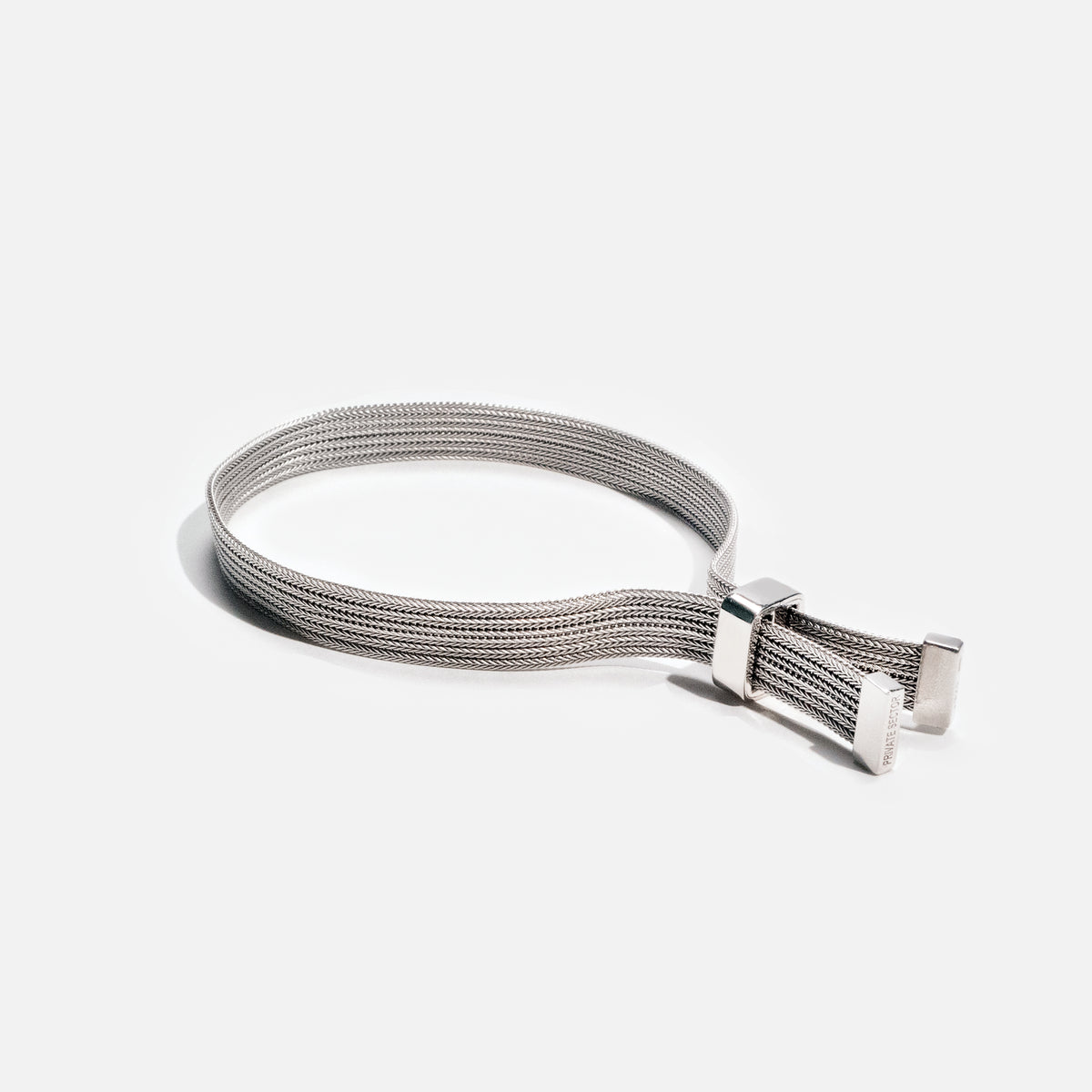 silver mesh bracelet with adjustable clasp on white background