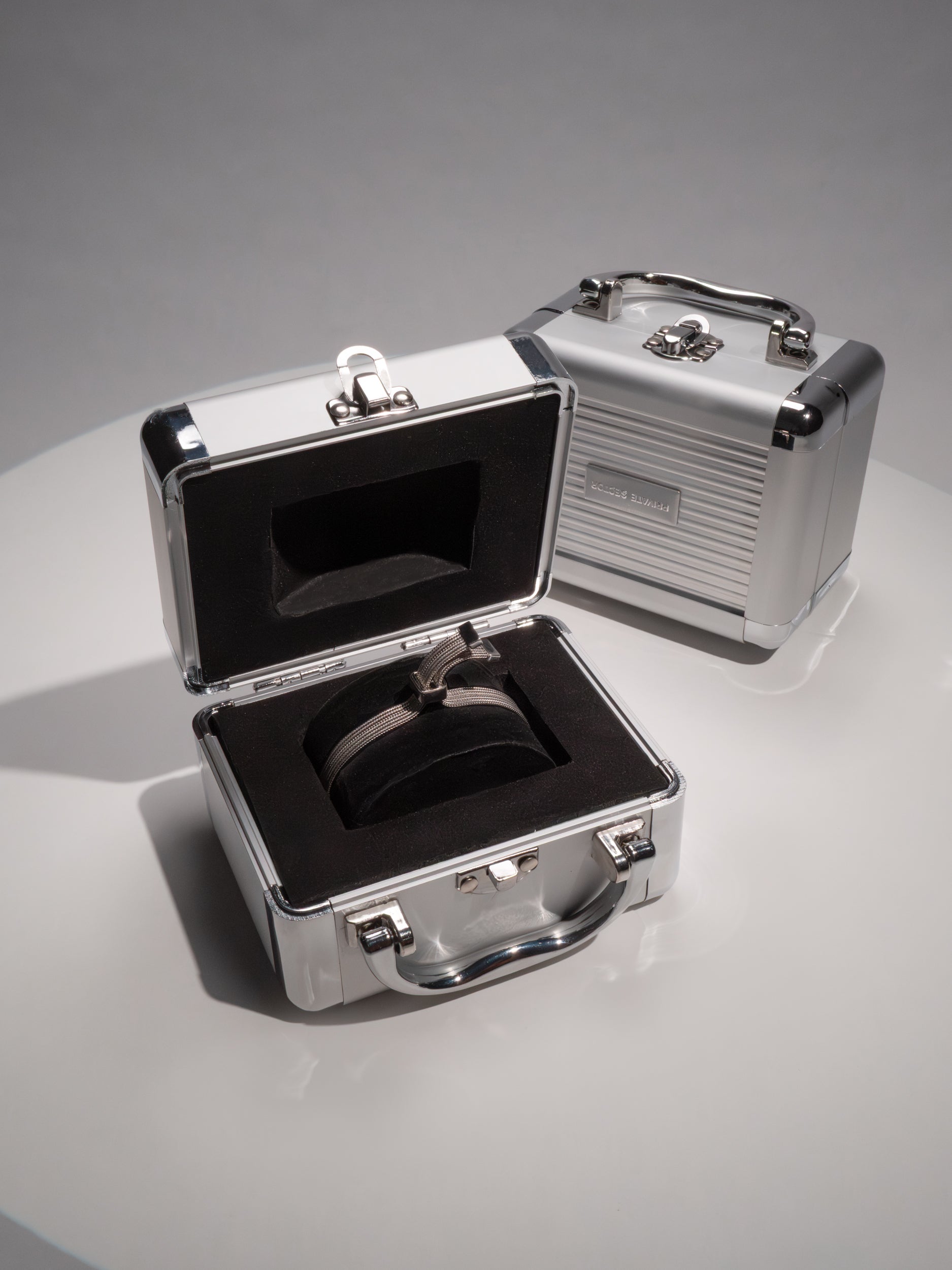 silver mesh bracelet in a metal briefcase