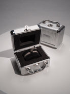 silver mesh bracelet in a metal briefcase