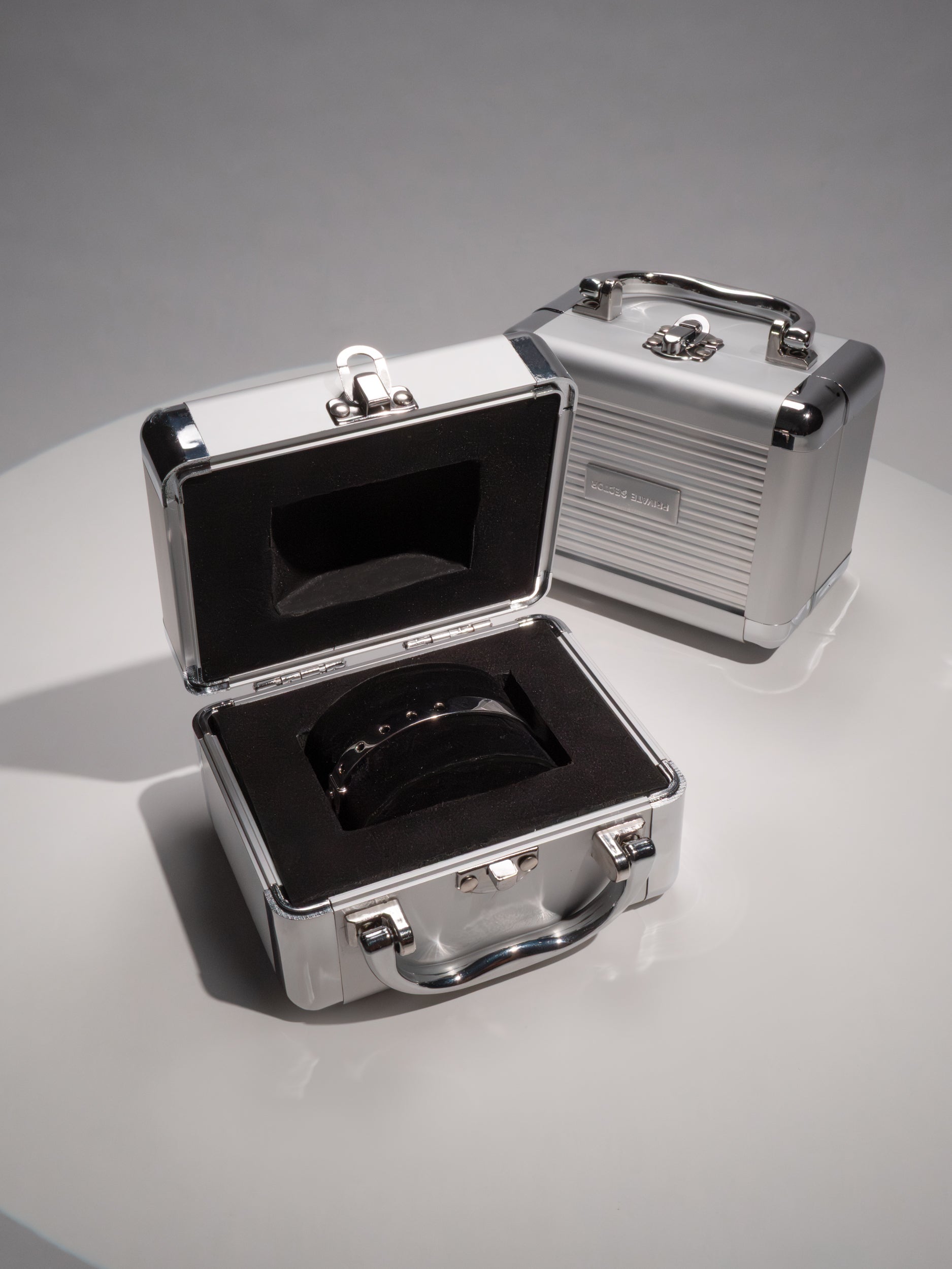 silver cuff bracelet in a metal briefcase