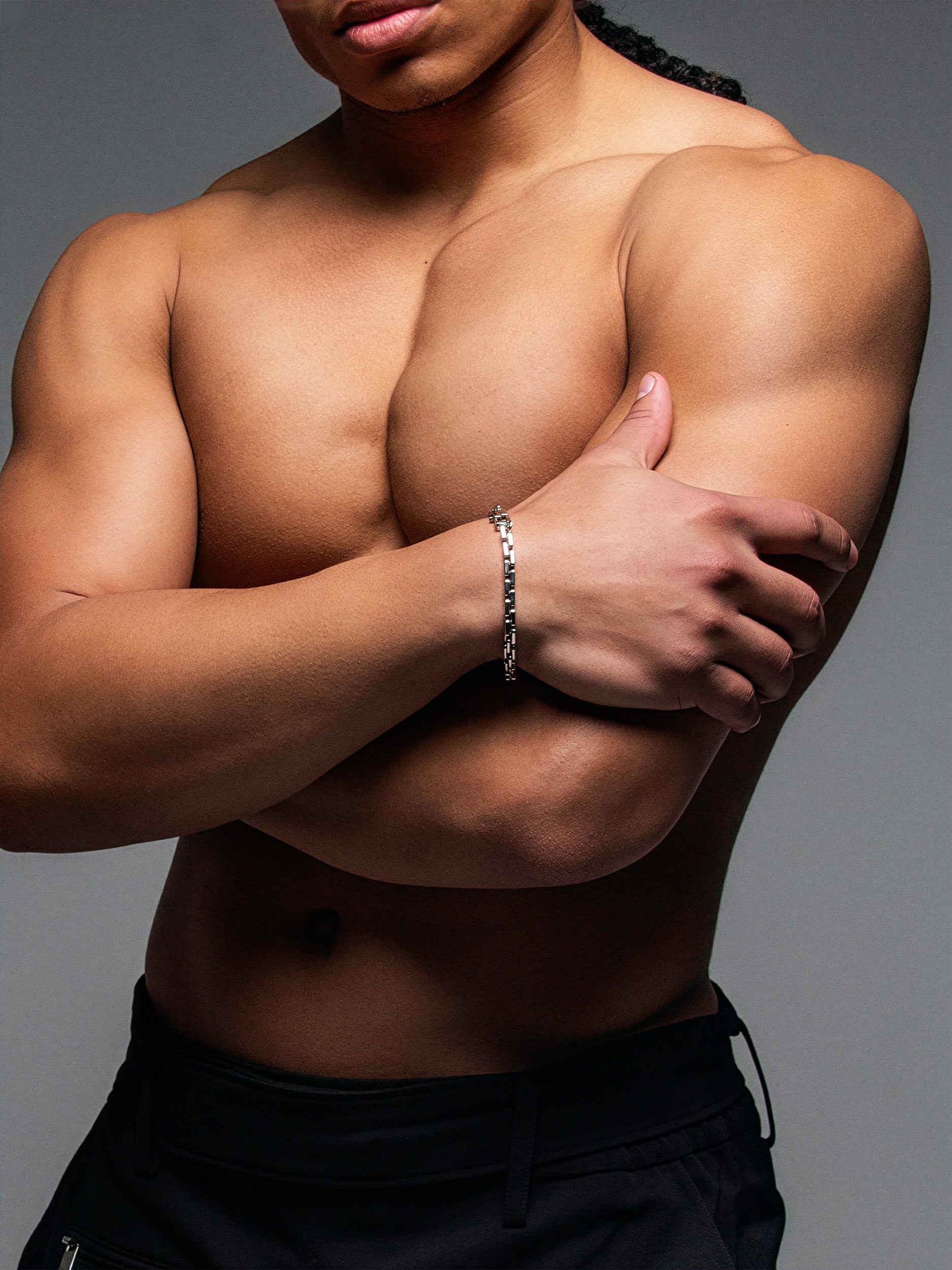 silver bracelet on a male model's wrist